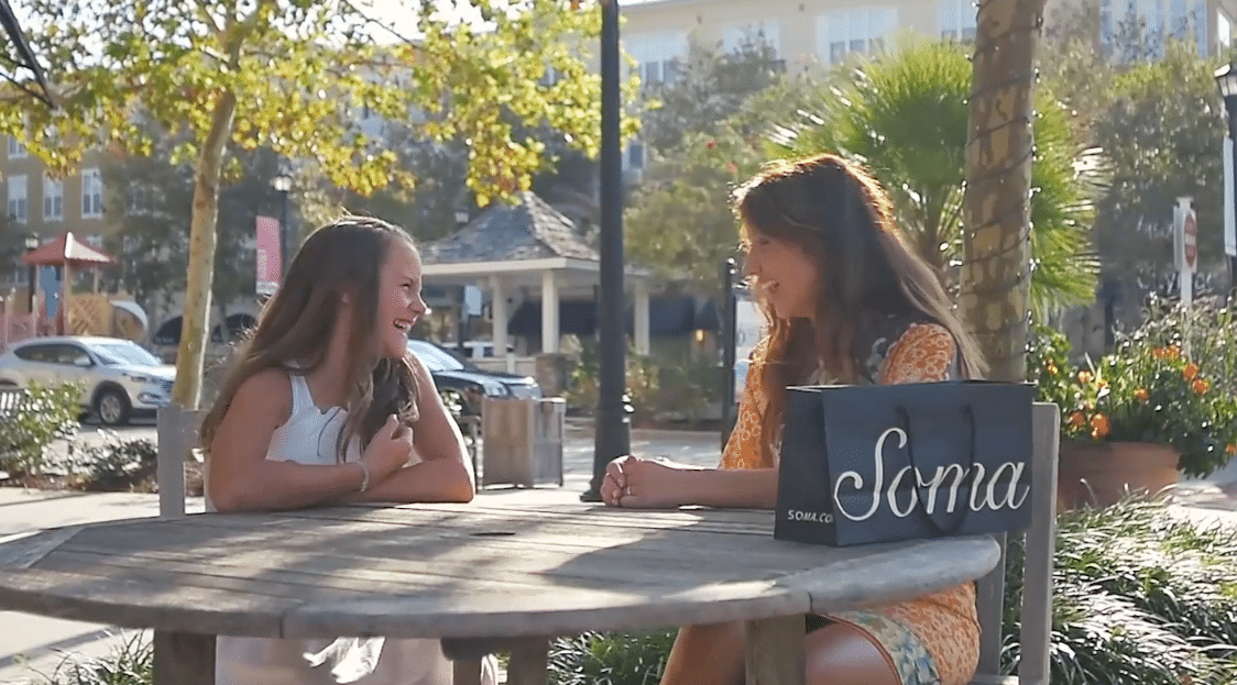 Mom and Daughter talking at a table