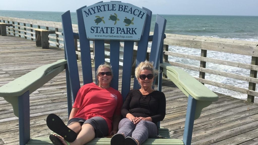 Two woman on a beach chair at Myrtle Beach State Park