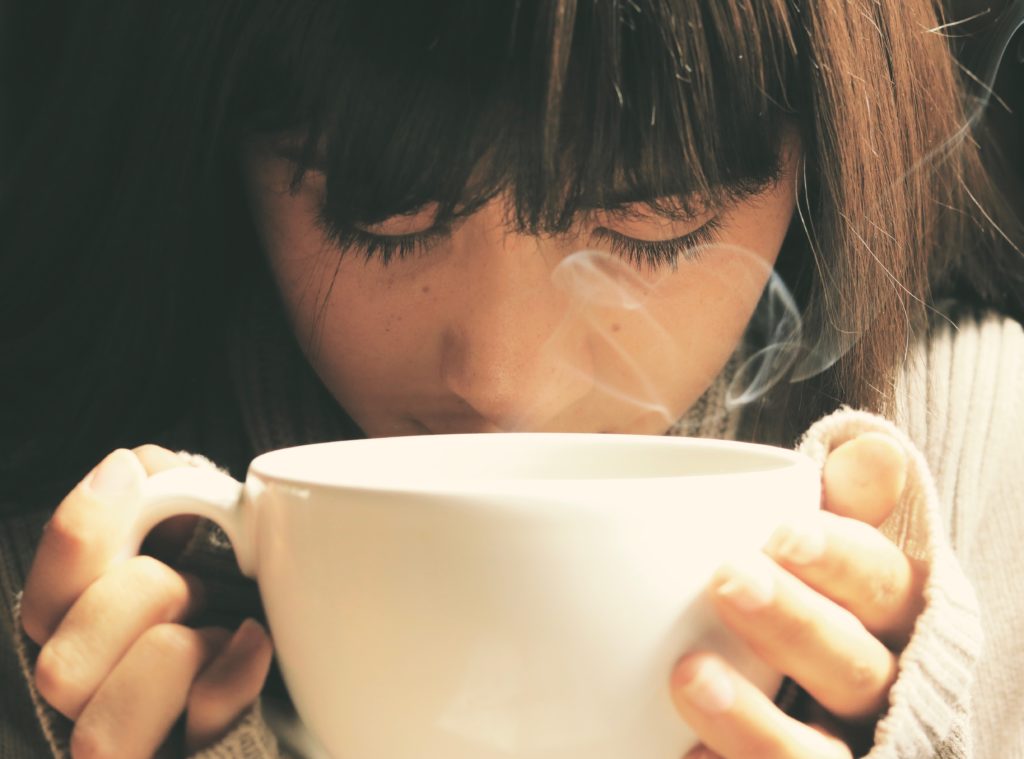 Girl Drinking Coffee in Cup