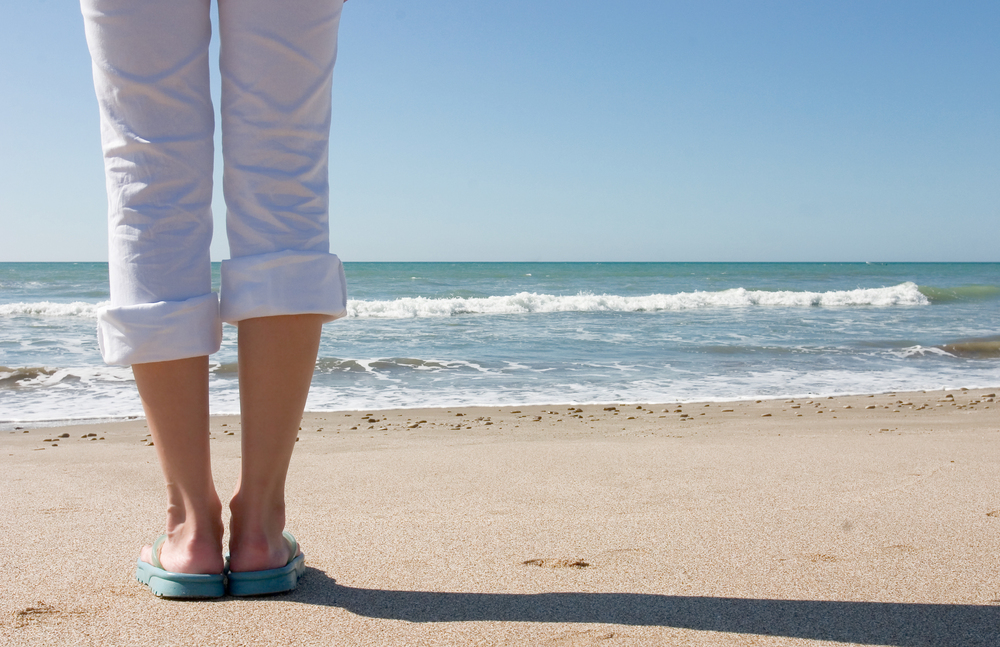 Lady standing on the beach